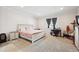 Comfortable bedroom with a bed, a nightstand, and a window providing natural light at 226 S Shady Grove Ct, Aurora, CO 80018