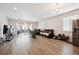 Expansive living room with bright lighting, wood floors, and sliding glass door at 226 S Shady Grove Ct, Aurora, CO 80018