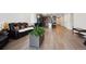 Open-concept living room with a large sofa and open kitchen at 226 S Shady Grove Ct, Aurora, CO 80018