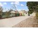 Backyard with patio, privacy fence, mature trees, and ample space for outdoor activities and relaxation at 4764 High St, Denver, CO 80216