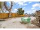 Spacious backyard featuring a patio, privacy fence, and mature trees for enjoying outdoor living at 4764 High St, Denver, CO 80216