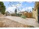 Large backyard with a patio and privacy fence, perfect for entertaining and relaxation at 4764 High St, Denver, CO 80216