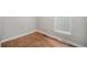 Bright bedroom with natural light features hardwood floors and base trim at 4764 High St, Denver, CO 80216