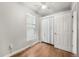Inviting bedroom with hardwood floors, ceiling fan, and closet space at 4764 High St, Denver, CO 80216
