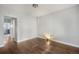 Spacious bedroom with wood floors, light walls, and multiple entryways at 4764 High St, Denver, CO 80216