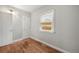 Inviting bedroom featuring warm hardwood floors and natural light at 4764 High St, Denver, CO 80216
