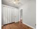 Bright bedroom with ceiling fan, closet, and hardwood flooring at 4764 High St, Denver, CO 80216