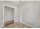Bedroom shows hardwood floors, light gray walls, and an open doorway leading to another room at 4764 High St, Denver, CO 80216