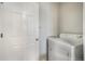 Interior laundry room features a standard white door and a white laundry dryer unit at 4764 High St, Denver, CO 80216