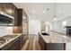 Beautiful kitchen featuring granite countertops, modern appliances, and an island with sink at 9274 Biscay St, Commerce City, CO 80022