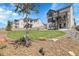 Well-manicured backyard featuring a lush lawn and multiple outdoor living spaces at 1174 Williams Loop, Elizabeth, CO 80107