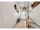 Stylish entryway with a decorated wall, a bench, and natural light coming from the glass pane door at 1174 Williams Loop, Elizabeth, CO 80107