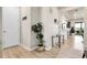 Bright and airy foyer with hardwood floors and a view into the open-concept living space at 1174 Williams Loop, Elizabeth, CO 80107