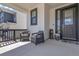 Inviting front porch with seating area, perfect for enjoying the outdoors at 1174 Williams Loop, Elizabeth, CO 80107