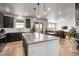 Spacious kitchen with granite island, stainless steel appliances, and hardwood flooring with an open floor plan at 1174 Williams Loop, Elizabeth, CO 80107