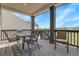 Covered patio with outdoor seating, offering stunning views of the surrounding landscape at 1174 Williams Loop, Elizabeth, CO 80107