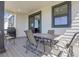 Back patio featuring an outdoor dining table and chairs, with views of the house and yard at 1174 Williams Loop, Elizabeth, CO 80107