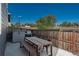 Enclosed patio area with dining furniture, grill, and storage unit at 7958 Tejon St, Denver, CO 80221