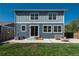 Backyard featuring a well-maintained lawn, patio area with seating, and string lights at 7958 Tejon St, Denver, CO 80221