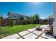 Backyard featuring a patio area with seating, trampoline, and string lights at 7958 Tejon St, Denver, CO 80221