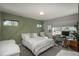 Inviting bedroom featuring a queen bed, a modern desk, and plenty of natural light at 7958 Tejon St, Denver, CO 80221