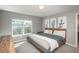Cozy bedroom features a comfortable bed and a view of the backyard at 7958 Tejon St, Denver, CO 80221