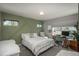 Bright bedroom with a geometric green accent wall and a dedicated workstation area at 7958 Tejon St, Denver, CO 80221