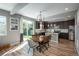 Bright dining area featuring an elegant light fixture and a sliding glass door to the backyard at 7958 Tejon St, Denver, CO 80221