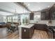 Bright, open kitchen with modern appliances, a center island, and seamless flow into the dining and living areas at 7958 Tejon St, Denver, CO 80221