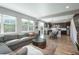 Open concept living space featuring a kitchen, dining area, and a spacious living room at 7958 Tejon St, Denver, CO 80221