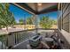 Relaxing porch with cozy seating around a modern fire pit, creating an inviting outdoor space at 7958 Tejon St, Denver, CO 80221