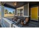 Cozy porch with a fire pit and comfortable seating, perfect for enjoying outdoor living and relaxation at 7958 Tejon St, Denver, CO 80221