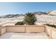 A treed backyard is covered in snow at 27 Tamarade Dr, Littleton, CO 80127