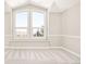 A bedroom has a large window offering pretty views at 27 Tamarade Dr, Littleton, CO 80127