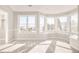 A bedroom has a bay window with mountain views at 27 Tamarade Dr, Littleton, CO 80127