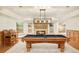 A basement game room includes a pool table and custom lighting at 27 Tamarade Dr, Littleton, CO 80127