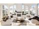 Bright living room with mountain views, a fireplace, and comfortable seating at 27 Tamarade Dr, Littleton, CO 80127