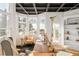 Bright office featuring a dark coffered ceiling, built-in shelving, and mountain views at 27 Tamarade Dr, Littleton, CO 80127