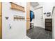 Entryway features a tile floor, hall tree, and an 