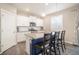 Beautiful kitchen island with seating, a pendant light, and modern countertops at 8395 E 132Nd Pl, Thornton, CO 80602