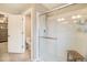 Bathroom with a glass-enclosed shower, tiled walls and a built-in shower seat at 8395 E 132Nd Pl, Thornton, CO 80602