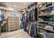 Spacious walk-in closet with wooden floors, clothing racks, shelves and storage at 8395 E 132Nd Pl, Thornton, CO 80602