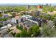 Aerial view showcasing a modern condo complex with rooftop patios in a vibrant urban setting at 33 S Ogden St, Denver, CO 80209