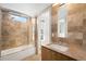 Bathroom with a walk-in shower, modern vanity, and natural stone design at 33 S Ogden St, Denver, CO 80209