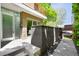 Modern condo entrance with frosted glass door, stylish fencing, and well-maintained landscaping at 33 S Ogden St, Denver, CO 80209