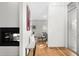 Elegant entryway features a fireplace and art, seamlessly connecting to the living and dining areas at 33 S Ogden St, Denver, CO 80209