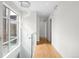 Hallway featuring contemporary chandelier and hardwood floors that add warmth to the space at 33 S Ogden St, Denver, CO 80209