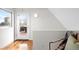 Hallway with hardwood flooring and a door to a small balcony at 33 S Ogden St, Denver, CO 80209
