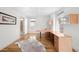 Bright home office features hardwood floors, custom cabinetry, and a large desk perfect for remote work at 33 S Ogden St, Denver, CO 80209