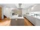 Bright, modern kitchen with stainless steel appliances, a central island, and sleek cabinets at 33 S Ogden St, Denver, CO 80209